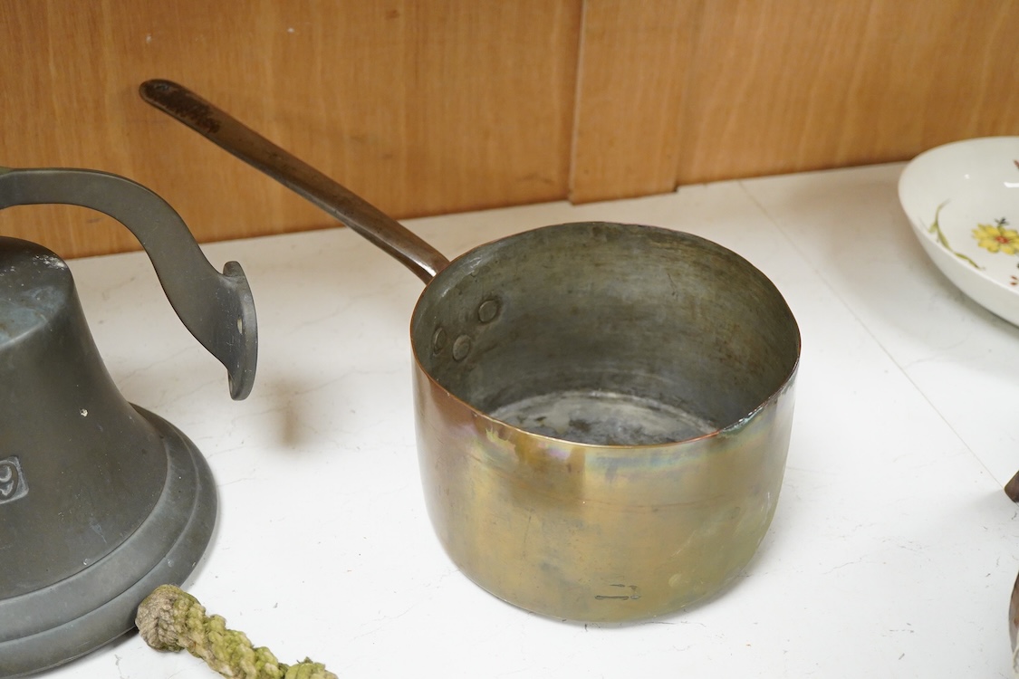 A bronze bell dated 1839 and two Victorian copper and brass saucepans
